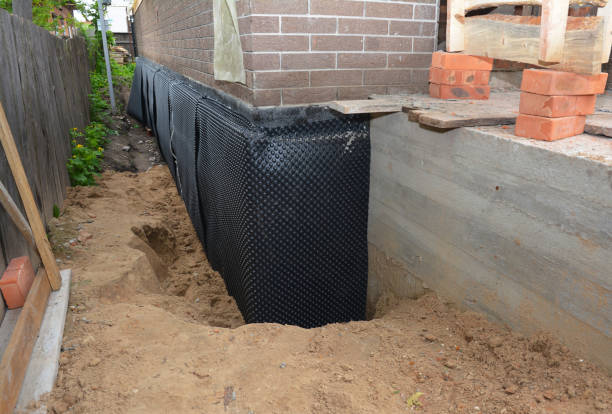 Happy homeowners after waterproofing job in Warminster